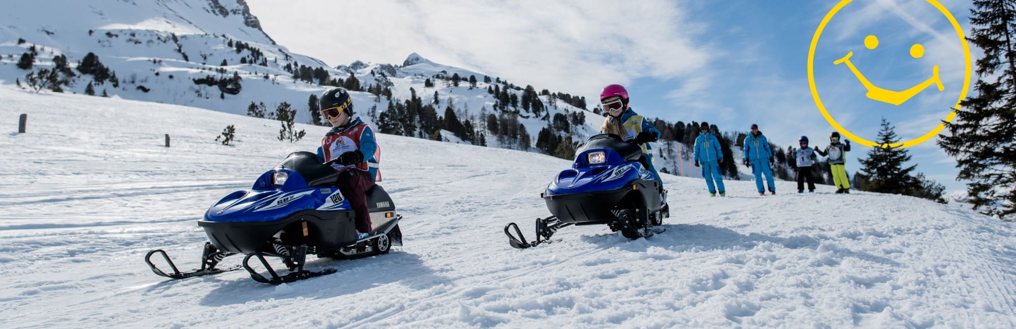 Kids having fun riding the mini ski doos in Obertauern